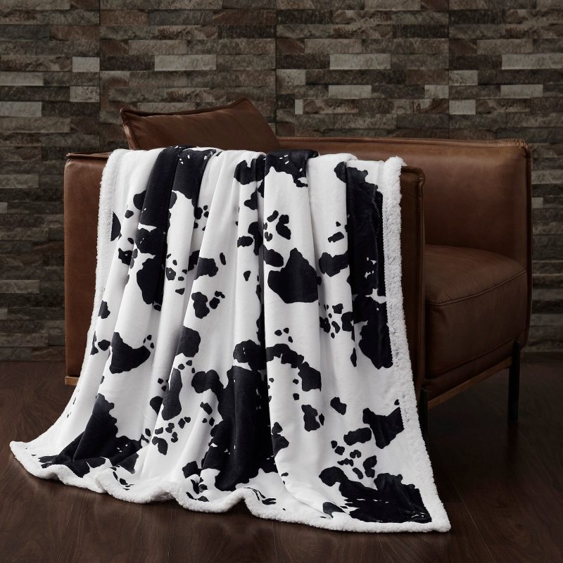 paseo road throw black elsa cowhide campfire sherpa throw 39567945105624